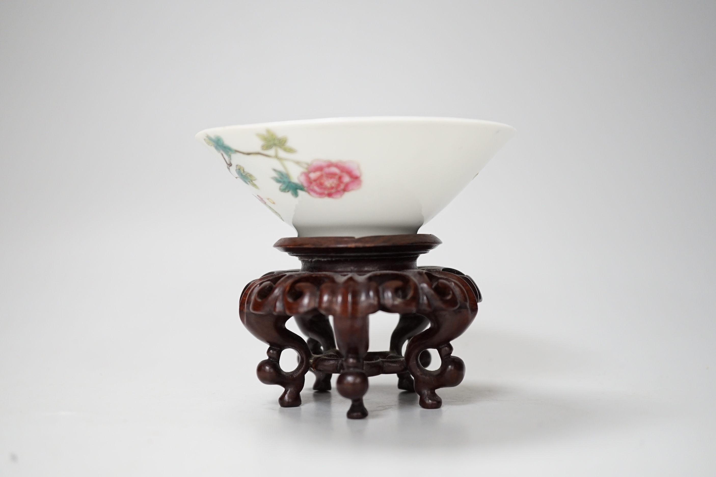 A Chinese famille rose conical bowl, Xuande mark but Republic period, wood stand 10cm diameter